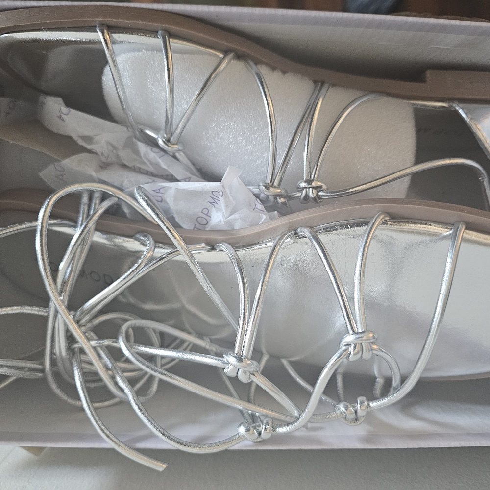 Never Worn. 2 pairs of sandals silver and black